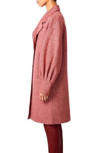 Model waring the coat from side view