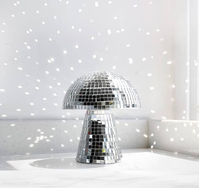 mushroom disco ball with glitter reflection on the wall