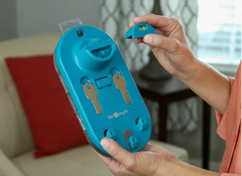 Model holding a blue magnet key leveler with storage space for screws and nails 