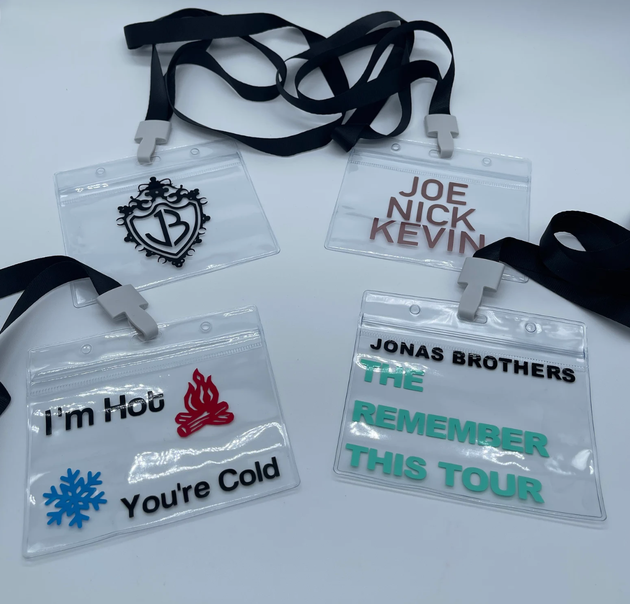 four jonas-inspired vax card holders with lanyards 