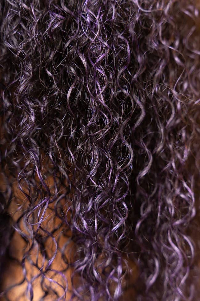 curly hair with the purple color gel in it