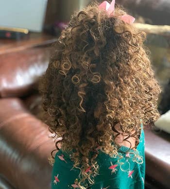 image of reviewer's child's curly hair
