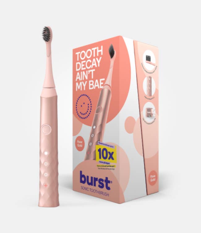 the toothbrush and packaging in rose gold color