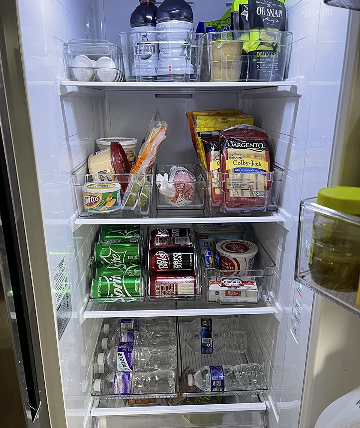 inside of a reviewer's fridge with everything neatly organized using the fridge organizers