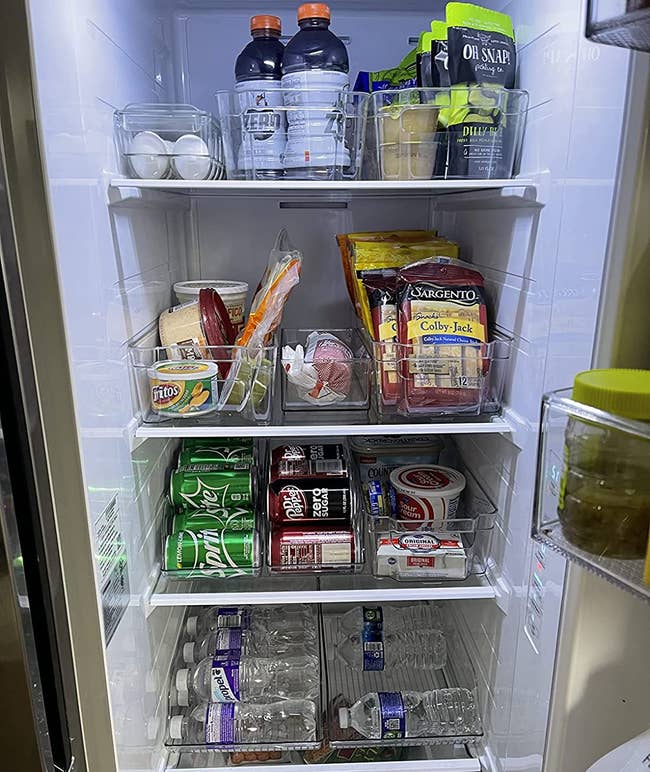 inside of a reviewer's fridge with everything neatly organized using the fridge organizers