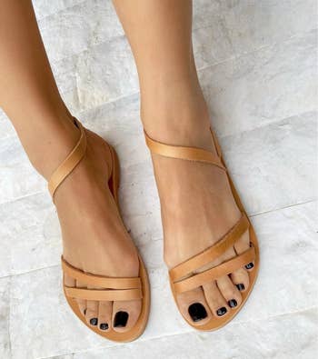 model's feet in the tan sandals