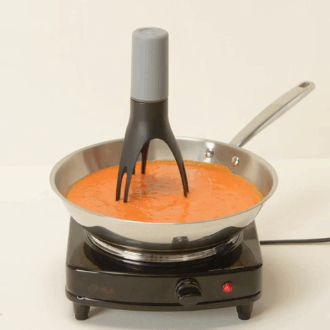 gif of a three-pronged stirrer moving in a pan
