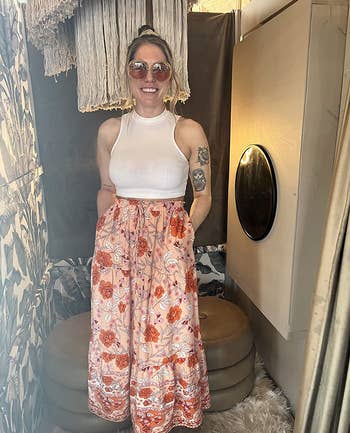 Reviewer wearing floral maxi skirt with white top