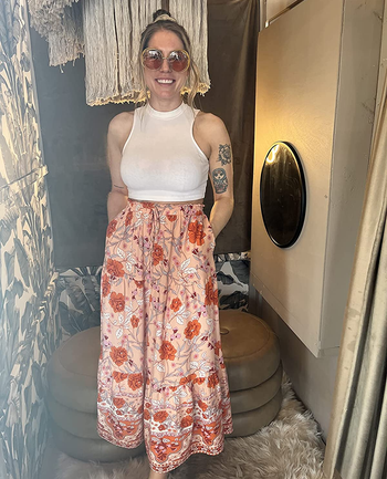 Reviewer wearing floral maxi skirt with white top