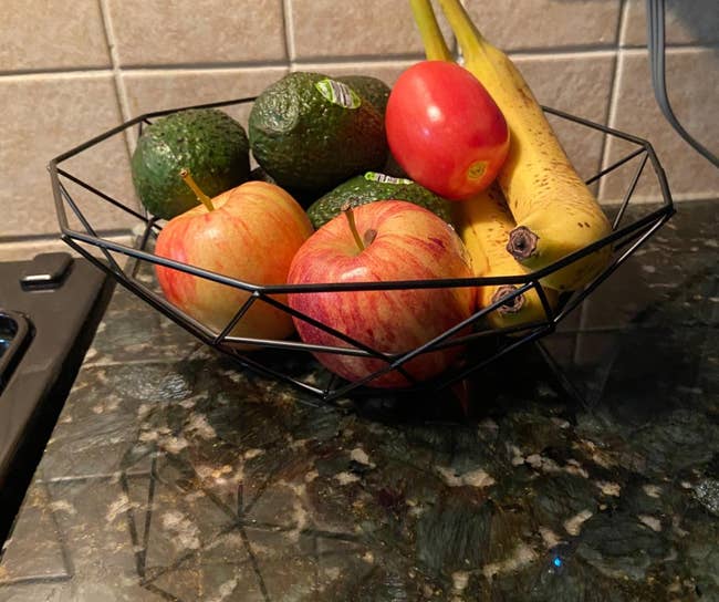 fruits in black wire basket