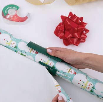 a model using the wrap cutter on snowman paper