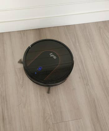 Reviewer photo of robot vacuum on floor