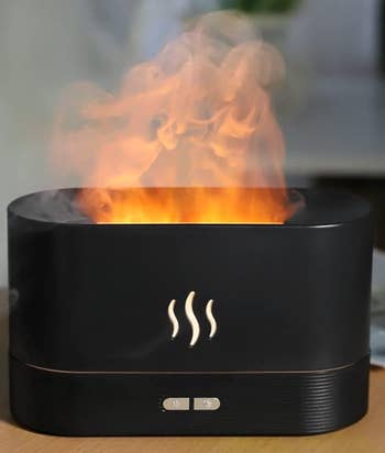the black humidifier with steam that looks like smoke coming out