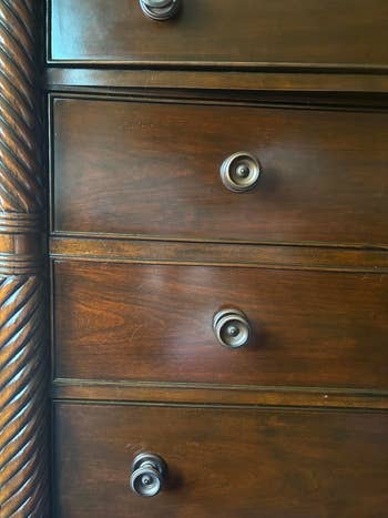 the same dresser after the use of wood polish