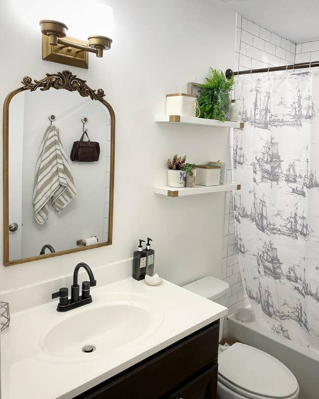 gilded reflector successful a reviewer's bathroom