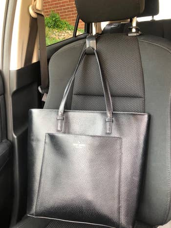 hook facing forward on passenger seat holding reviewer's large tote