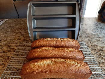 a reviewer's three loaves of bread out of the trio baking pan