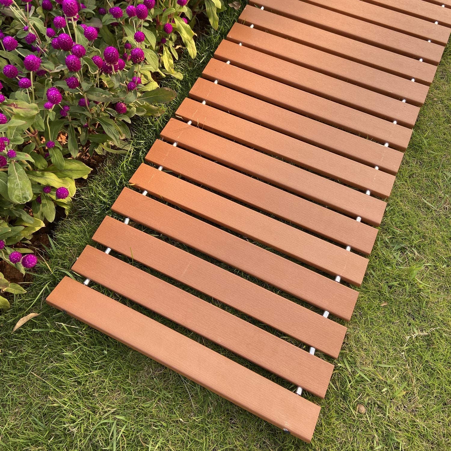 walkway beside a flower bed