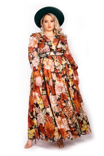 model wearing brown and yellow floral maxi dress