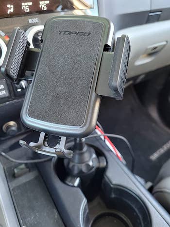 reviewer photo of phone mount in cup holder