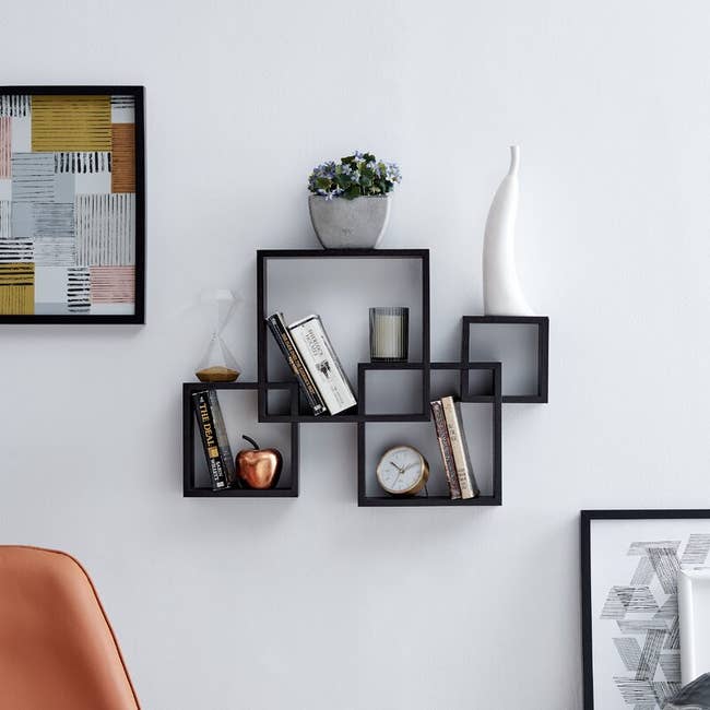 A black square shelf with items on it