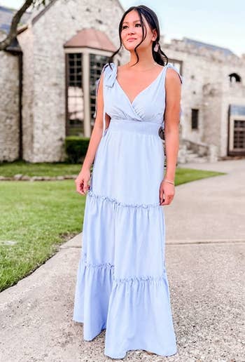 reviewer wearing the dress in light blue