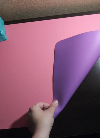 another reviewer showing the double-sided feature of a purple and pink office pad