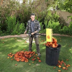 model using the same rake to dump the leaves in a trash can