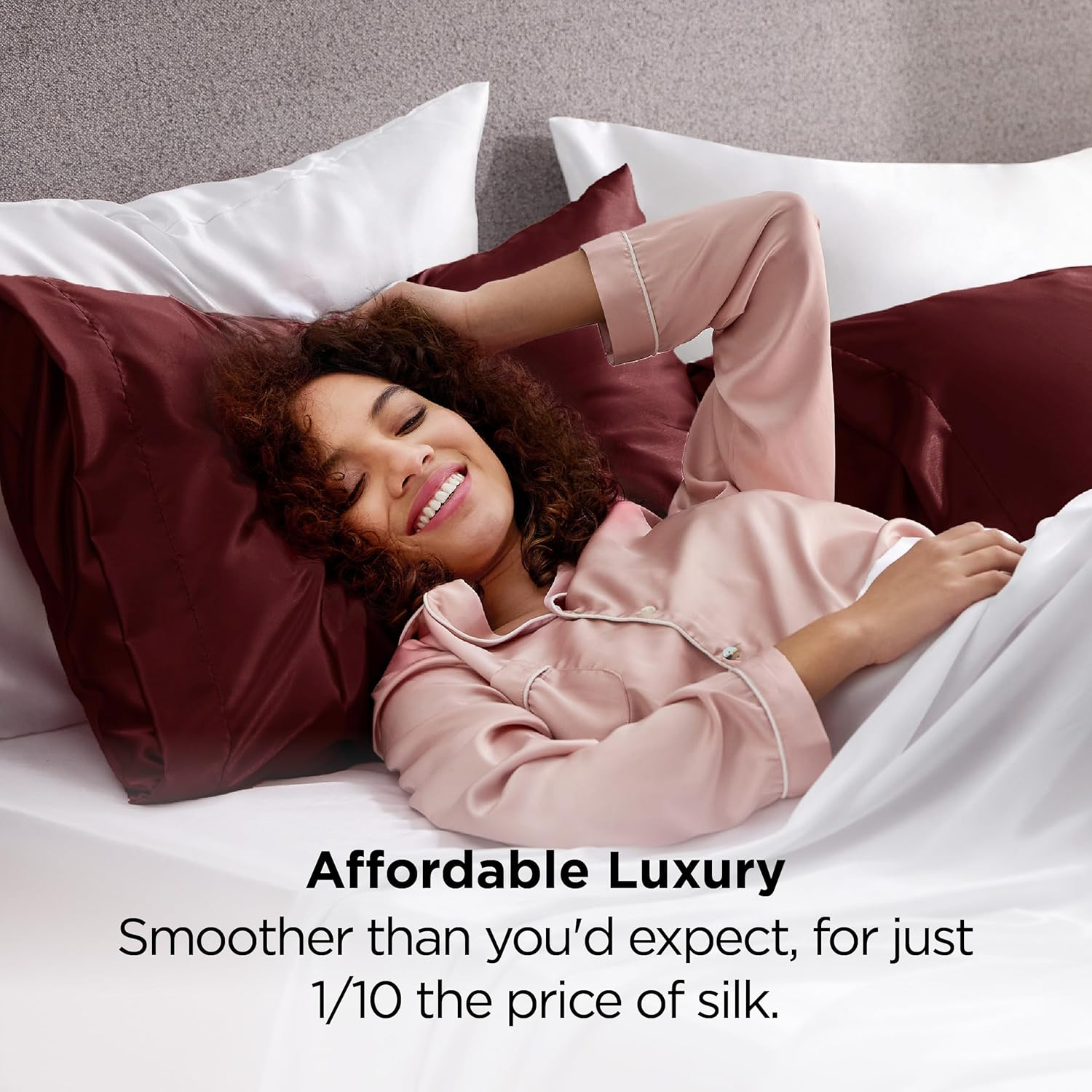 Model successful  silk pajamas smiling portion    reclining connected  a furniture  with satin pillowcases