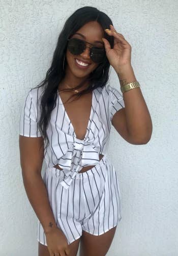 reviewer wearing the striped romper