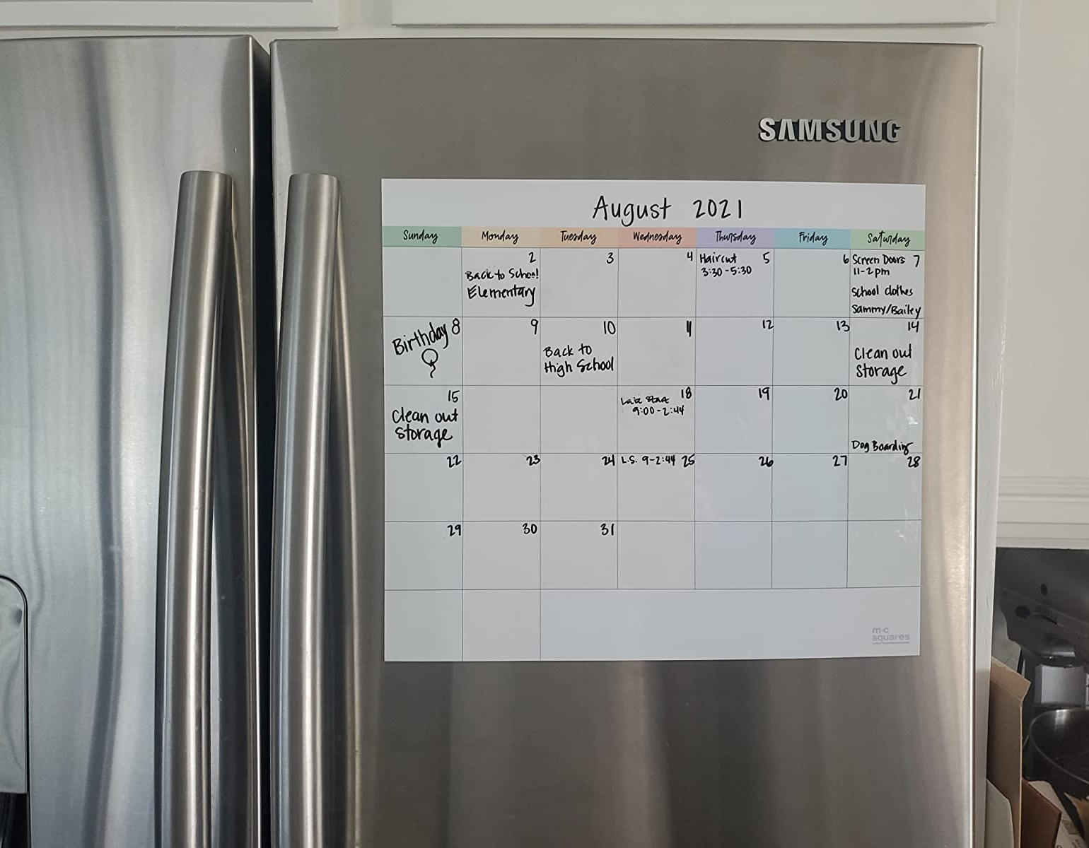 reviewer photo showing the calendar on their fridge 