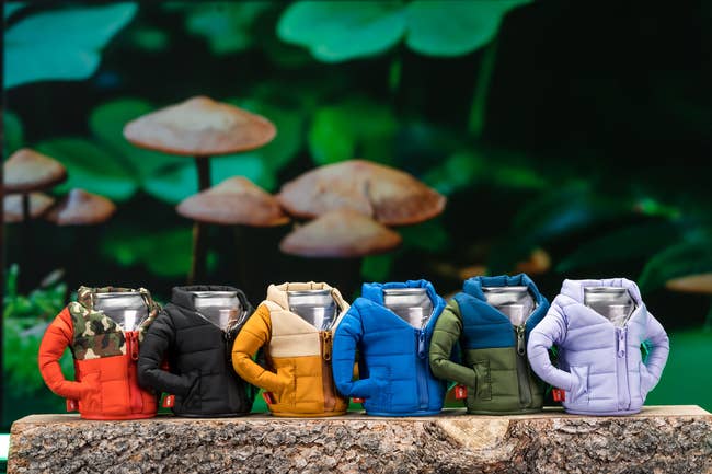 Puffer jacket cup holders in red, black, yellow, blue, green, and lilac