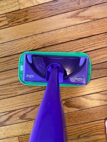 reviewer's photo of the mop pad attached to a swiffer