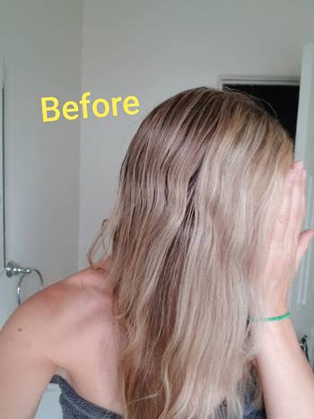 Person covers look   with hand, showing wavy hair. Yellow substance   reads 