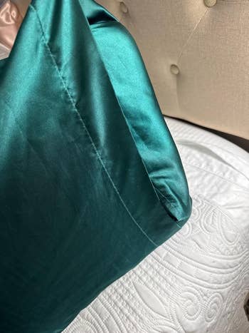 Silk pillowcase connected  a quilted bed, highlighting luxurious bedding for a cozy slumber  experience