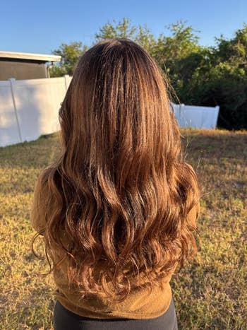 Same person with long, wavy hair now smooth and shiny