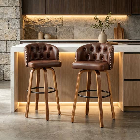 Two tufted leather barroom stools with woody legs successful a modern room setting