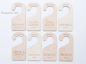 Eight wooden dividers labeled by clothing style