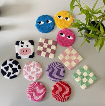 the punch needle coasters in a variety of fun designs