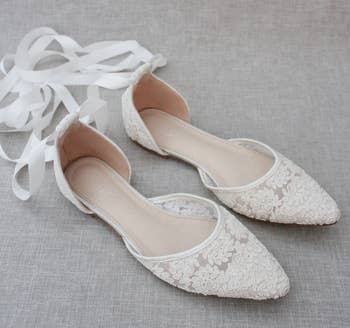 the white flats with ribbon straps