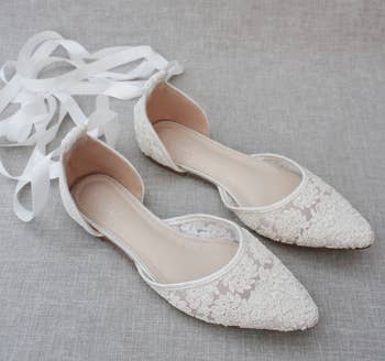 the white flats with ribbon straps