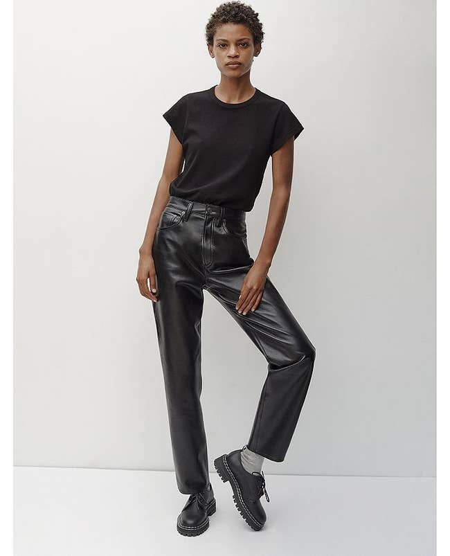 model wearing recycled leather pants and black t-shirt