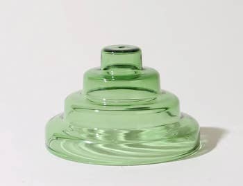 A green amber glass incense holder