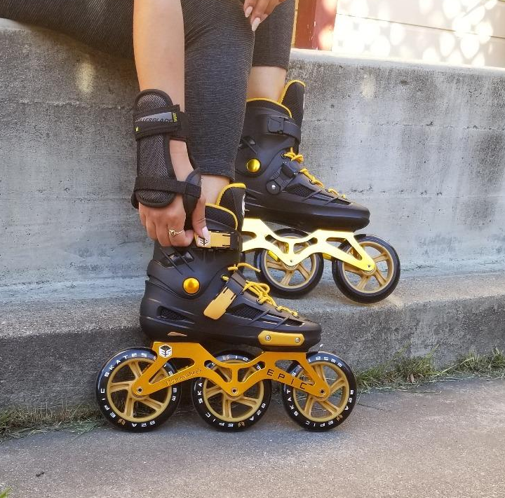 Reviewer wearing gold and black speed skates