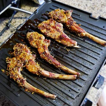 reviewer photo of lamb chops being cooked on the griddler