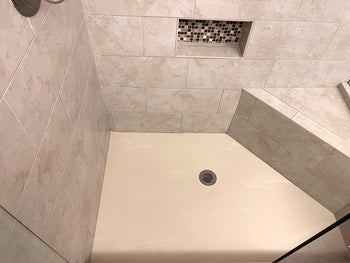 reviewer's after photo of clean show and tile free of mold