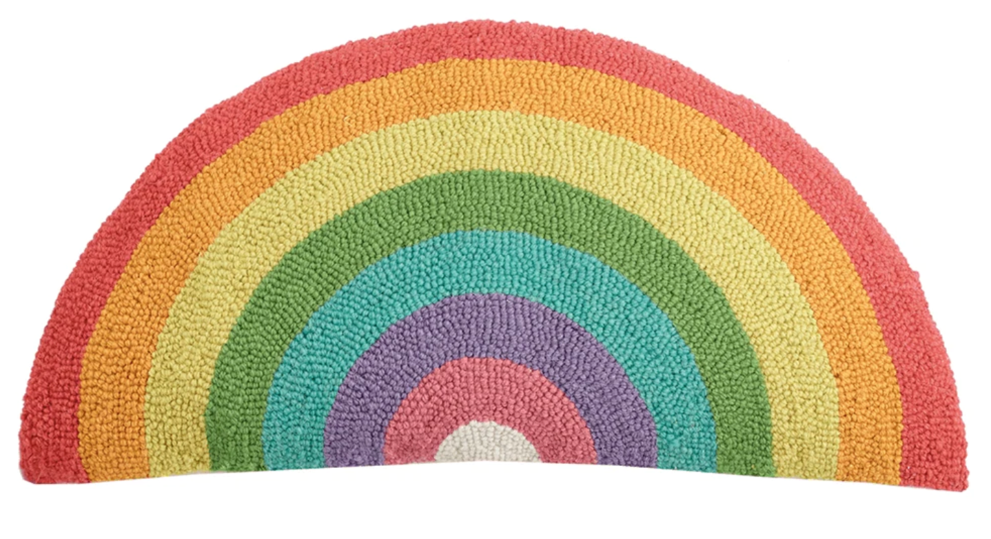 Rainbow-shaped hook pillow on a white background