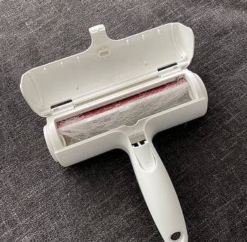 reviewer photo of the pet hair remover filled with hair