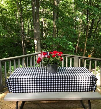 reviewer photo of the black and white tablecloth on a picnic table