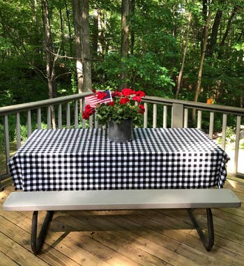 reviewer photo of the black and white tablecloth on a picnic table
